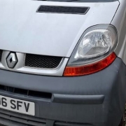 Silver Renault van parked on the street, showing front view and number plate YH06 SFV.