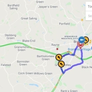 A digital map shows a driving route near Braintree, with traffic alerts and highlighted road sections.