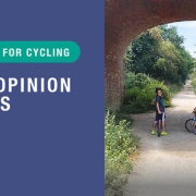 Three children with bikes on a sunny path under a brick bridge; text: "Your opinion counts – Our plan for cycling.